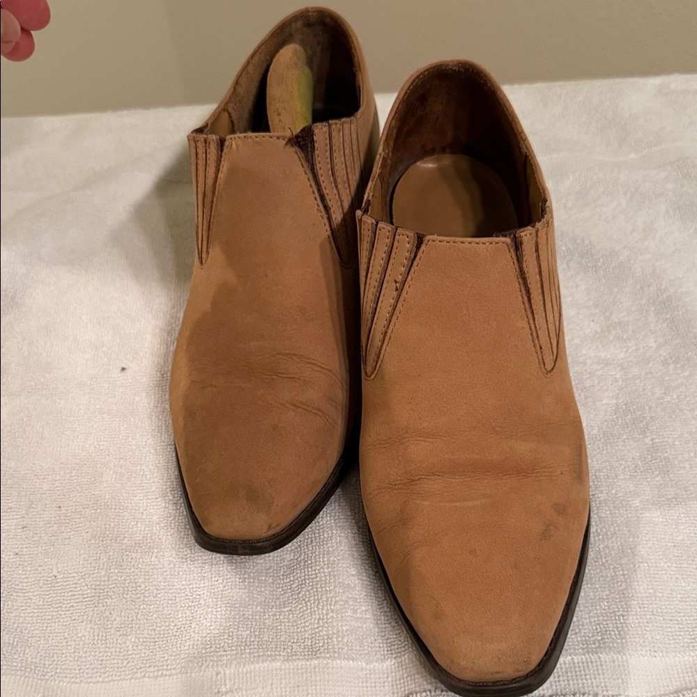 Beige/tan ankle boots slightly western in style one and a half inch heel.